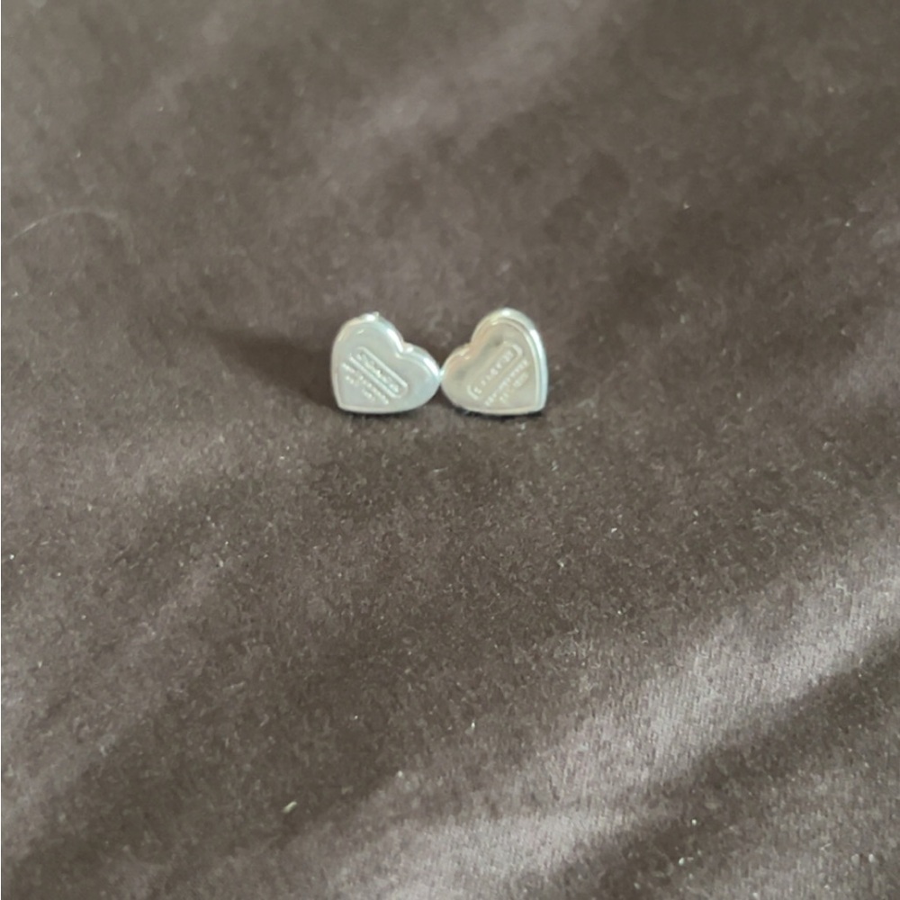 Coach stud heart earrings
Sterling silver